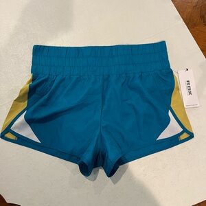 Reebok turquoise and chartreuse wide band running shorts. NEW!